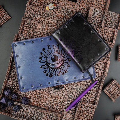 Custom handmade leather pocket journal with wraparound Beholder Eye Beast design on the spine and covers by Grimbeard Leather