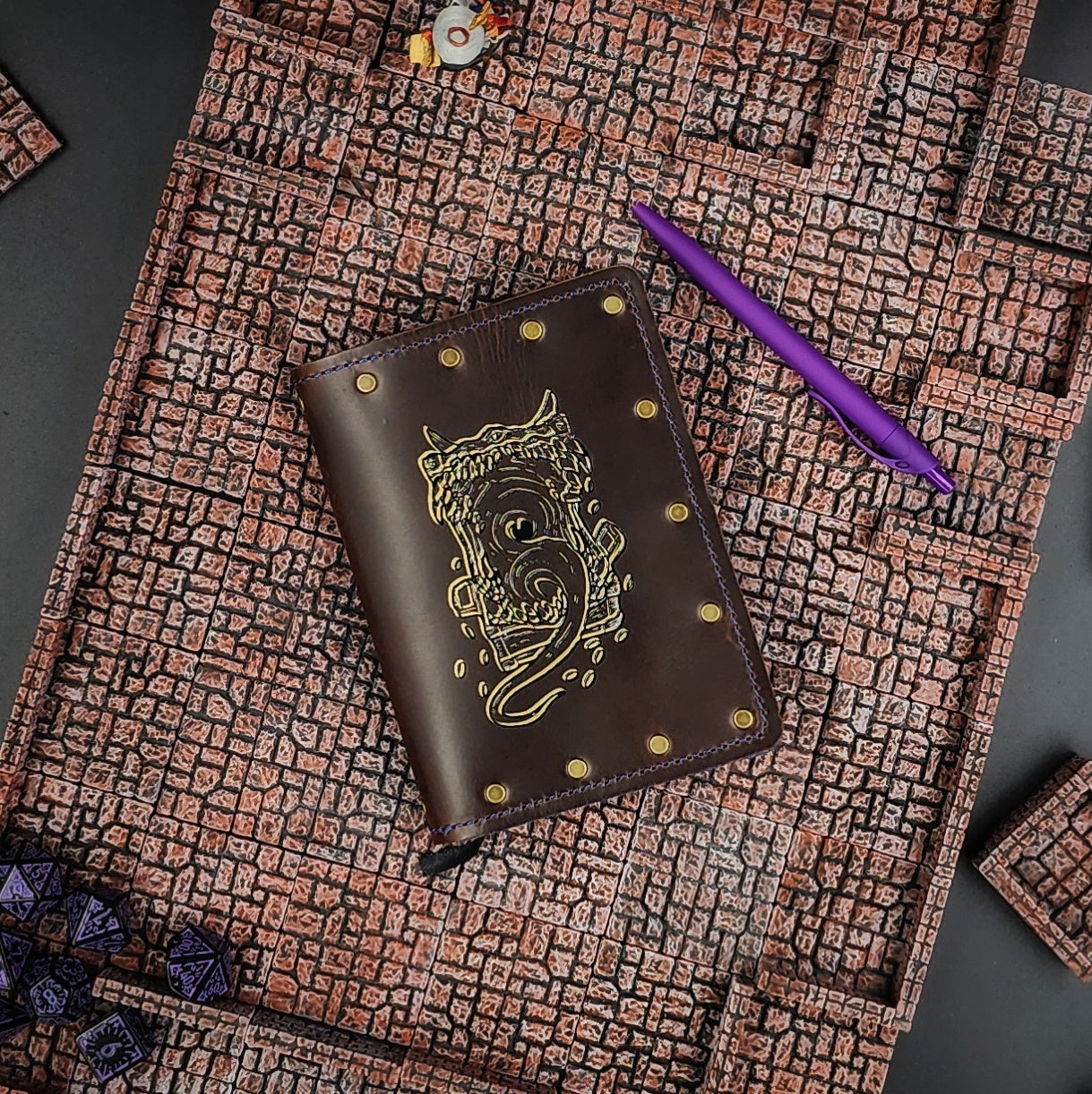 Custom handmade leather pocket journal with D&D Mimic monster design showing gaping mouth and teeth by Grimbeard Leather
