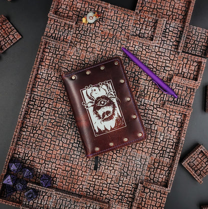 Custom handmade leather pocket journal with D&D Beholder inspired Eye Beast design by Grimbeard Leather