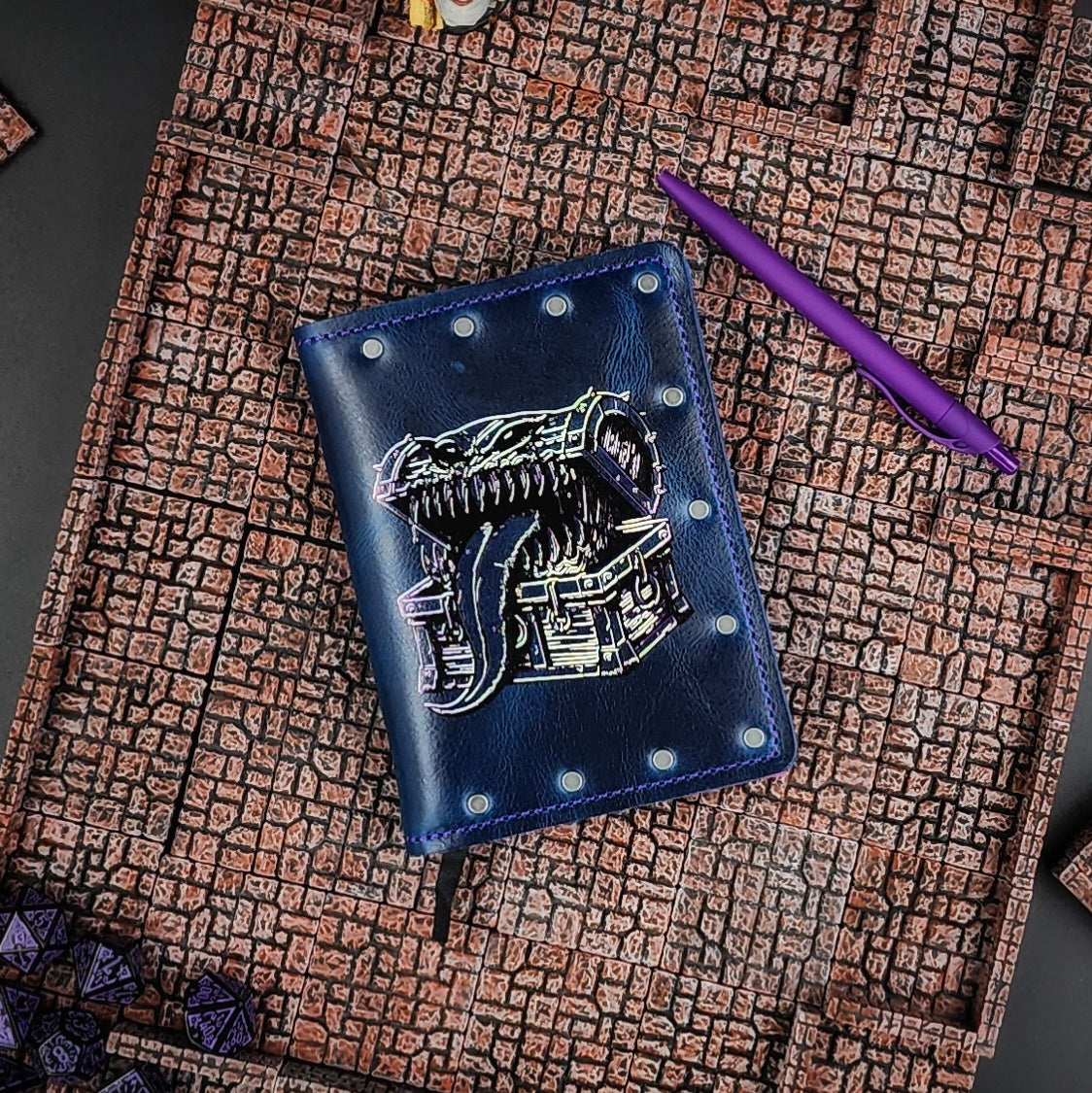 Custom handmade leather pocket journal with D&D Mimic treasure chest design featuring pointy teeth and a long tongue by Grimbeard Leather