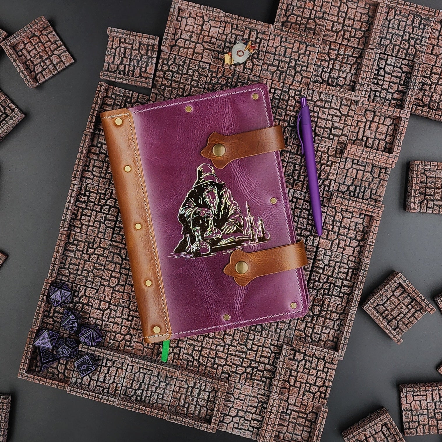 Handmade A5 leather adventure journal with hand-gilded original design of Grimbeard the Wizard working on potions and alchemy by Grimbeard Leather
