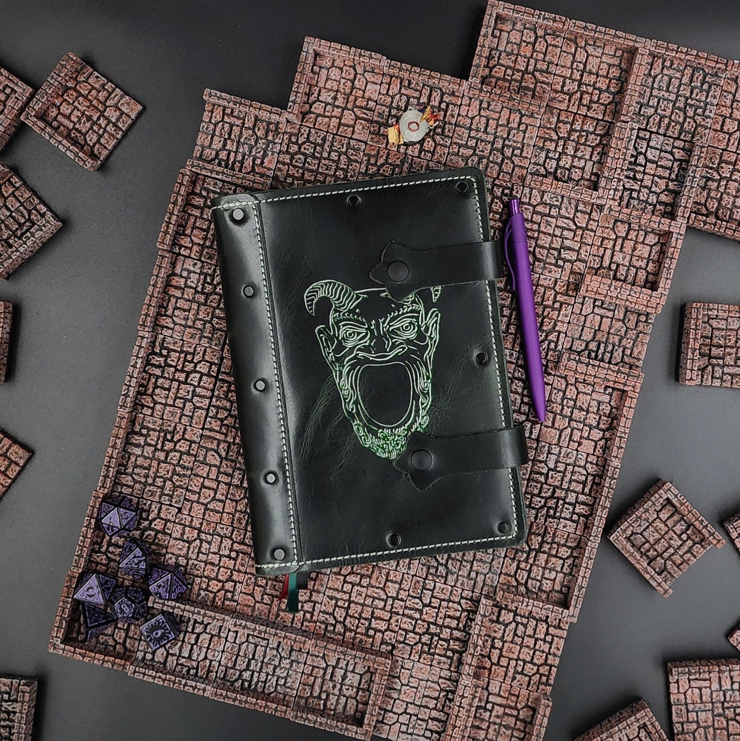 Handmade A5 leather adventure journal with hand-gilded Great Demon Face from Tomb of Horrors design by Grimbeard Leather