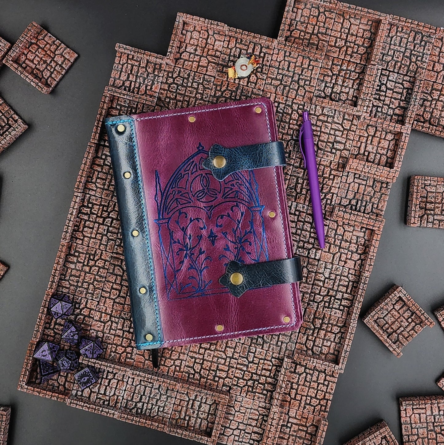 Handmade A5 leather adventure journal with hand-gilded Elven Gothic arch and leaf linework design by Grimbeard Leather