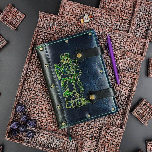Handmade A5 leather adventure journal with hand-gilded dwarven statue and warhammer design by Grimbeard Leather