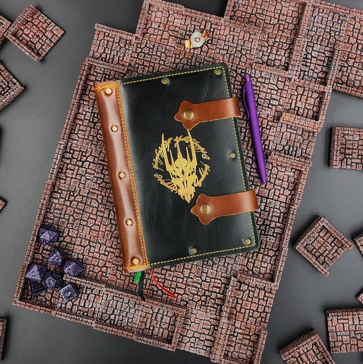 Handmade A5 leather adventure journal with hand-gilded Sauron helmet and elvish ring script design by Grimbeard Leather