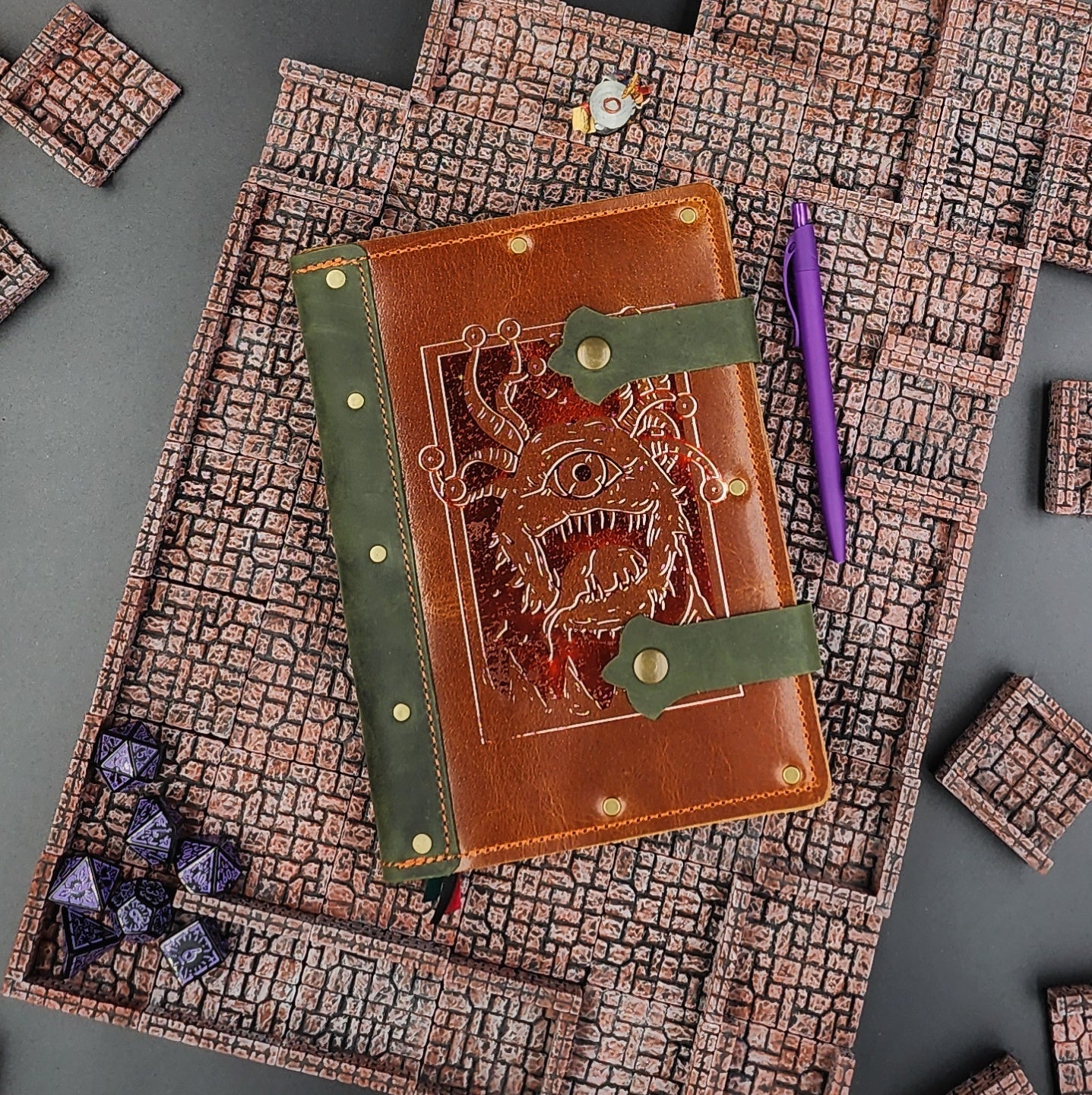 Handmade A5 leather adventure journal with hand-gilded D&D Beholder eye tyrant design by Grimbeard Leather