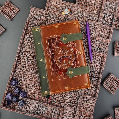 Handmade A5 leather adventure journal with hand-gilded D&D Beholder eye tyrant design by Grimbeard Leather