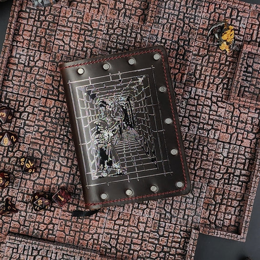 Custom handmade leather pocket journal with dungeon corridor and torch-bearing adventurer design by Grimbeard Leather