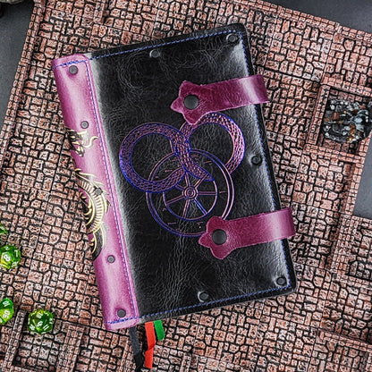 Handmade A5 leather adventure journal with hand-gilded Wheel of Time Serpent and Great Wheel design by Grimbeard Leather