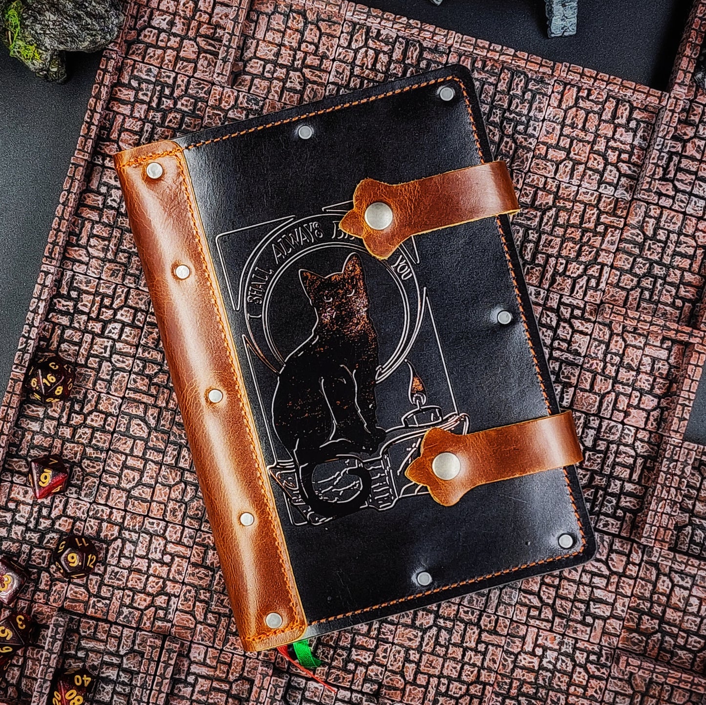 Handmade A5 leather adventure journal with hand-gilded black cat, candle, and "I shall always be with you" design by Grimbeard Leather