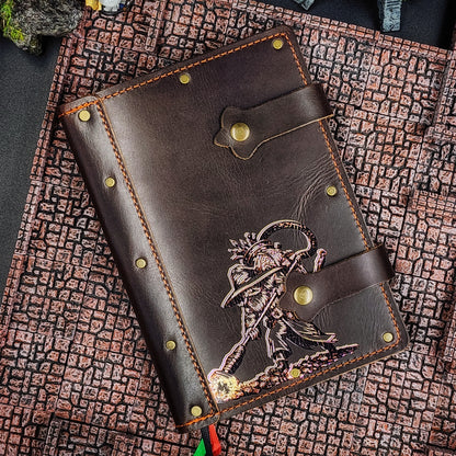 Handmade A5 leather adventure journal with hand-gilded original design of Grimbeard the Wizard using a vacuum backpack to collect treasure by Grimbeard Leather