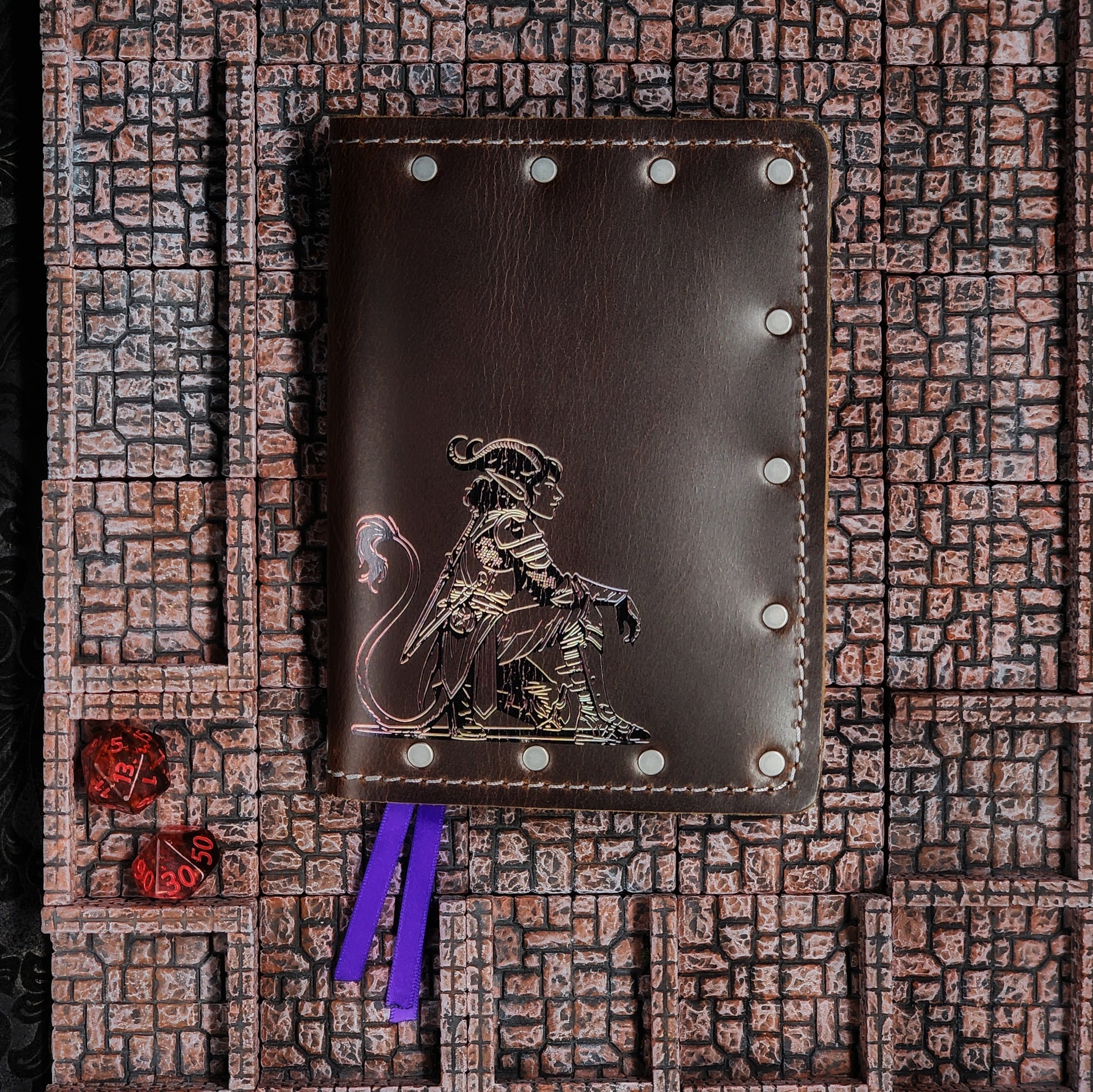 Custom handmade leather pocket journal with D&D Tiefling character design featuring horns and tail by Grimbeard Leather