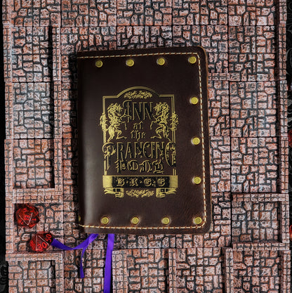 Custom handmade leather pocket journal with Lord of the Rings inspired Prancing Pony Inn sign design by Grimbeard Leather