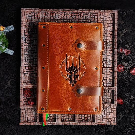 Handmade A5 leather adventure journal with hand-gilded Sauron helmet and elvish ring script design by Grimbeard Leather