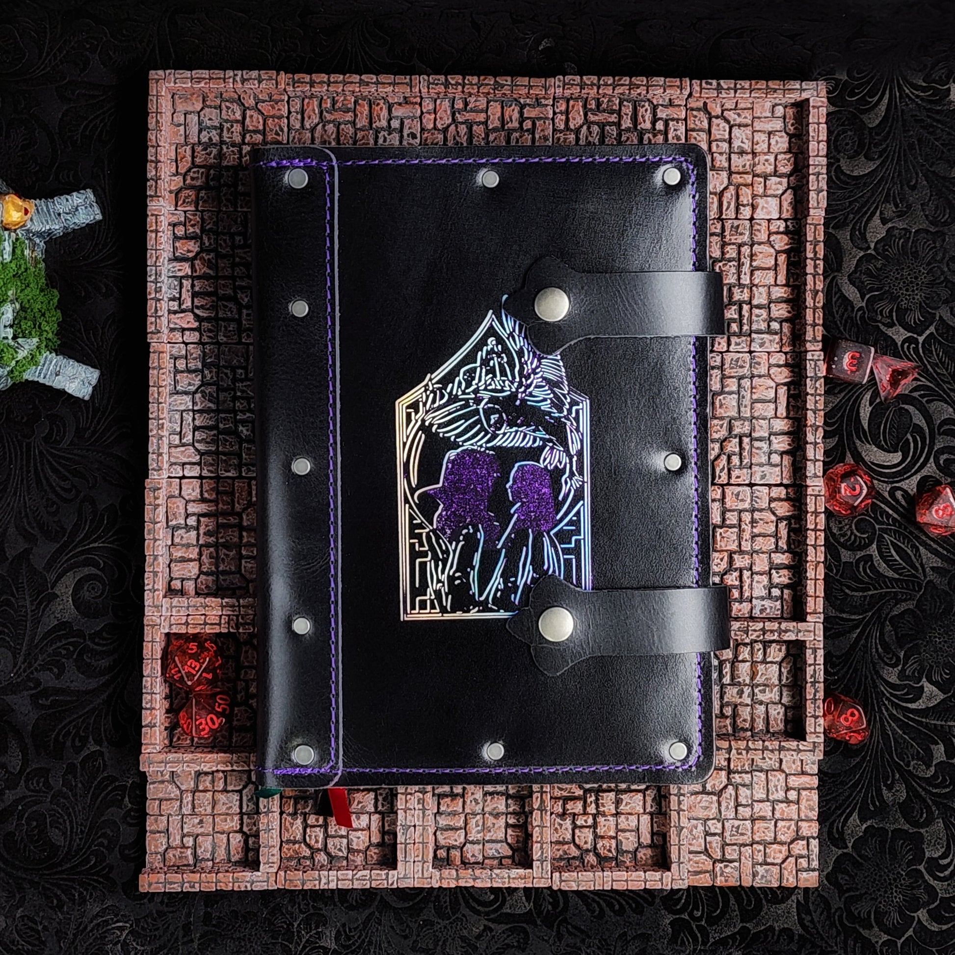 Handmade A5 leather adventure journal with hand-gilded line art of Jareth's hand, Sarah silhouette, and the Goblin City castle by Grimbeard Leather