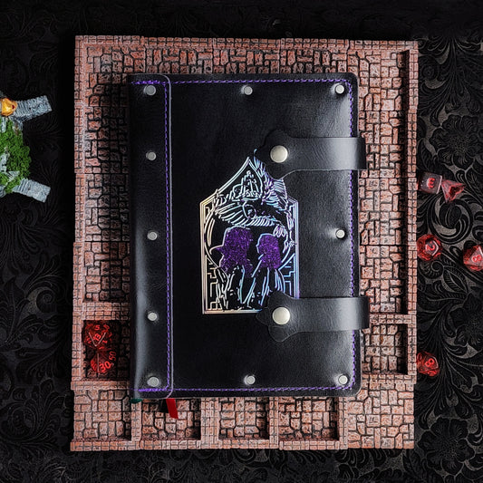 Handmade A5 leather adventure journal with hand-gilded line art of Jareth's hand, Sarah silhouette, and the Goblin City castle by Grimbeard Leather