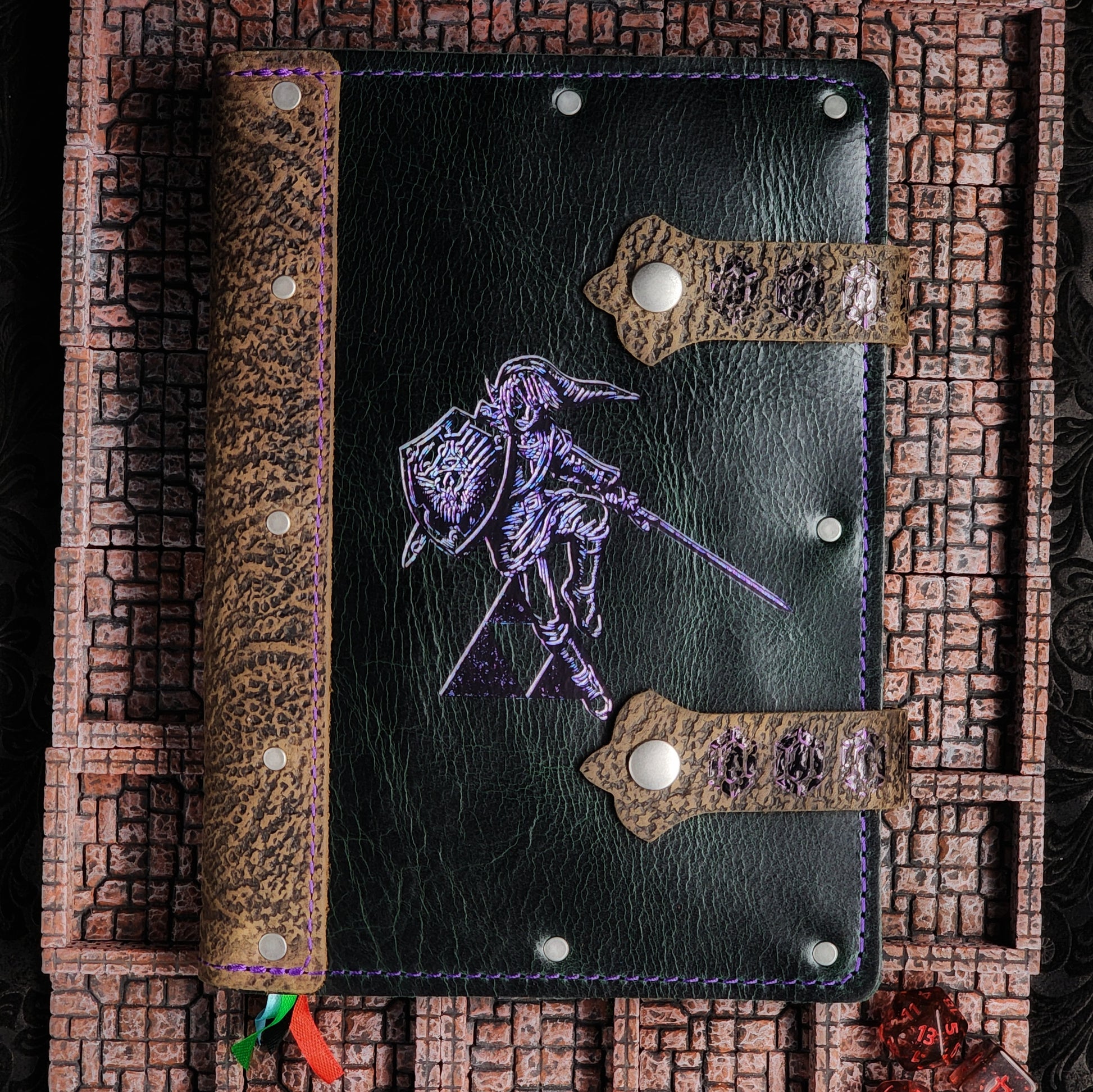 Handmade A5 leather adventure journal with hand-gilded Link, Hylian Shield, and Rupee strap design by Grimbeard Leather