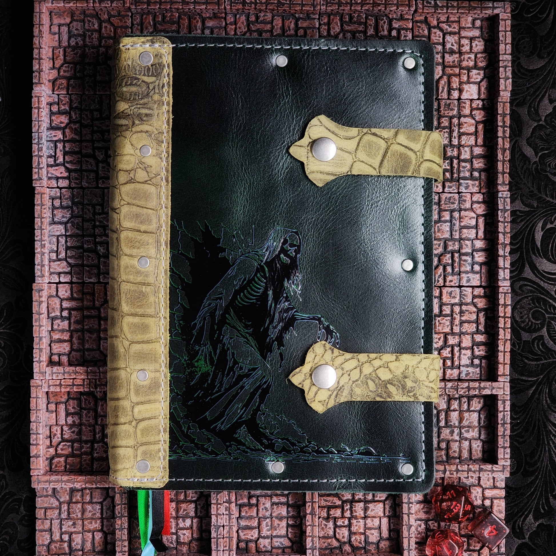 Handmade A5 leather adventure journal featuring a hand-gilded Acererak the Lich walking out of the spine design by Grimbeard Leather