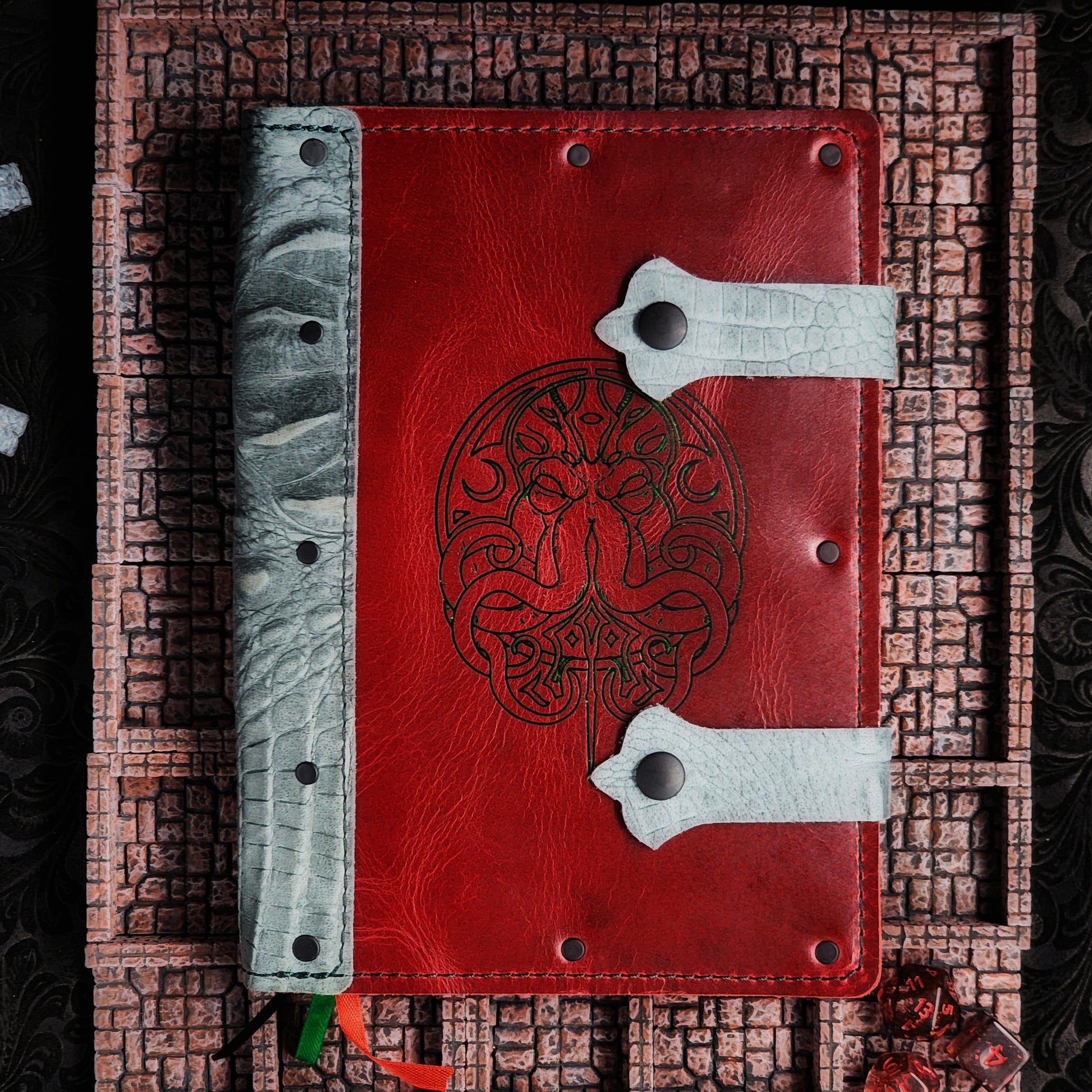Handmade A5 full-grain leather adventure journal with hand-gilded Cthulhu line art design by Grimbeard Leather