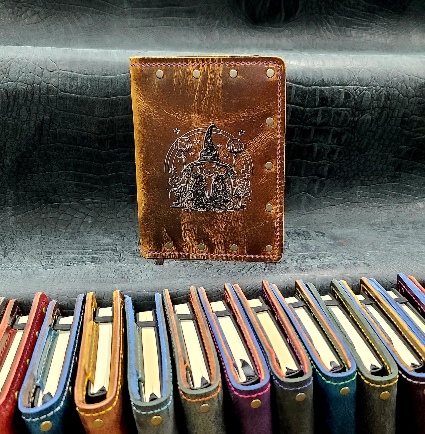Custom handmade leather pocket journal with wizard mouse and forest mushroom design by Grimbeard Leather