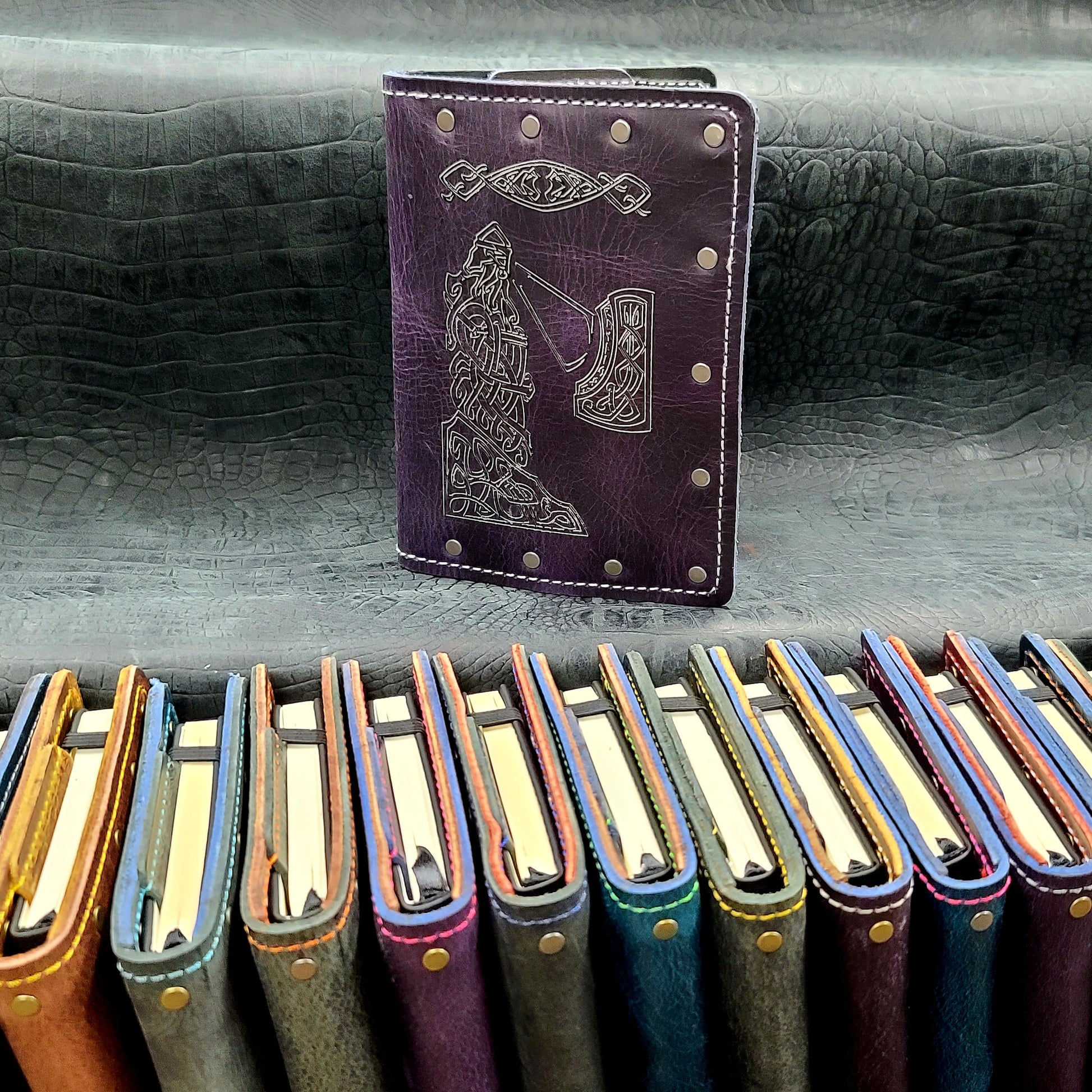 Custom handmade leather pocket journal with hand-gilded Nordic warrior, Celtic knotwork, and Elder Futhark runes design by Grimbeard Leather