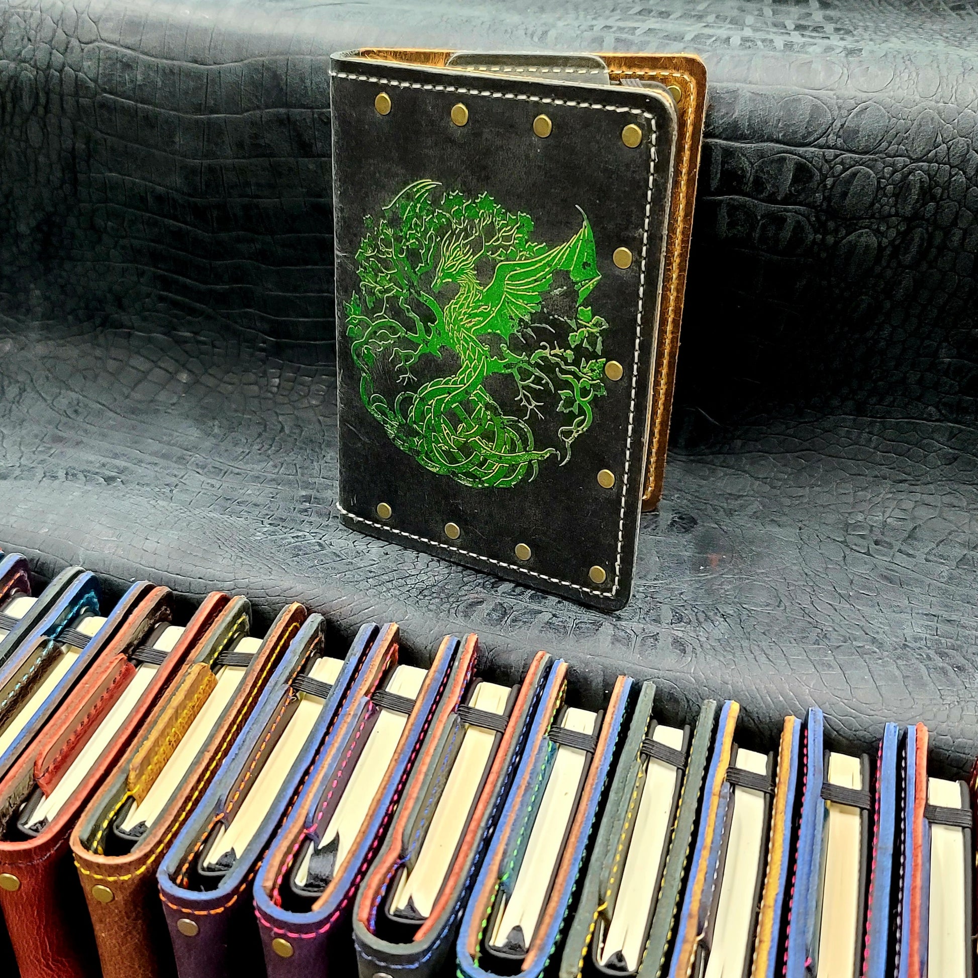 Custom handmade leather pocket journal with Nordic Tree of Life Yggdrasil design featuring a dragon trunk by Grimbeard Leather