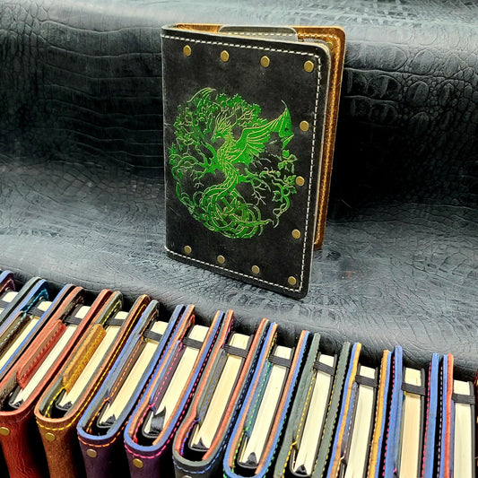 Custom handmade leather pocket journal with Nordic Tree of Life Yggdrasil design featuring a dragon trunk by Grimbeard Leather