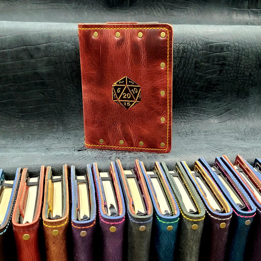 Custom handmade leather pocket journal with hand-gilded 20-sided die D20 design by Grimbeard Leather