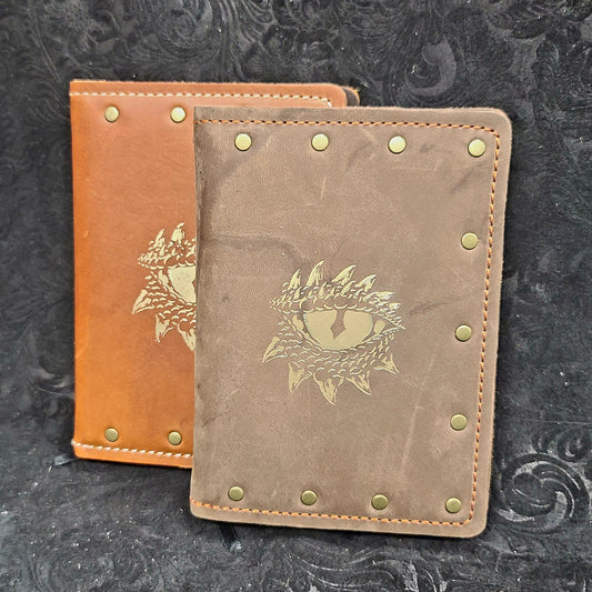 Custom handmade leather pocket journal with hand-gilded dragon eye and surrounding scales design by Grimbeard Leather