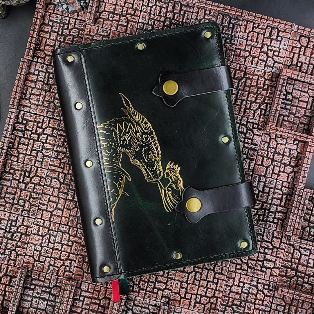 Handmade A5 full-grain leather adventure journal with hand-gilded Woman and Dragon design by Grimbeard Leather
